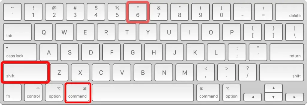 A close-up image of a standard QWERTY keyboard layout, likely for a Mac, highlighting three keys with red boxes: the **Shift** key on the left, the **Command** key on the bottom row next to the spacebar, and the **'^' / '6'** key on the top row.
